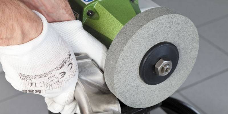 What are grinding wheels and what are they used for?